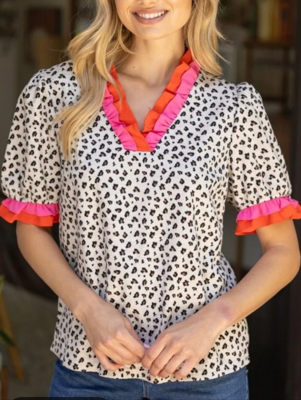 Voy Leopard Print V-Neck Ruffle Sleeve Top in White with Pink & Orange Trim.